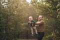 Dad is fooling around with his son. Dad throws his son in the air.Father playing with his son. Happy child. Father`s day Royalty Free Stock Photo