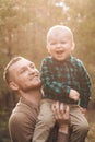 Dad is fooling around with his son. Dad throws his son in the air.Father playing with his son. Happy child. Father`s day Royalty Free Stock Photo