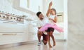 Dad, girl and ballet dance of a child in a home kitchen dancing together and bonding. Family man, father and kid dancer Royalty Free Stock Photo
