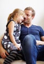 Dad, girl and laugh with smile, couch and embrace with love, daughter and house. Man, happy and lounge for bonding