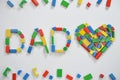 DAD and a heart with colorful wooden toy blocks Royalty Free Stock Photo