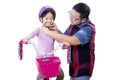 Dad helps his child to fasten helmet Royalty Free Stock Photo