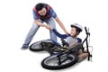 Dad helps his son after falling from bike Royalty Free Stock Photo