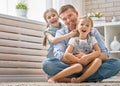 Dad and his daughters are playing Royalty Free Stock Photo