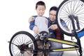 Dad and his son fixing a bicycle Royalty Free Stock Photo