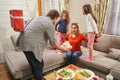 Dad holding gift behind back and preparing to give it