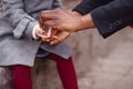 Dad holds daughter`s hand and wipes the other hand with a napkin