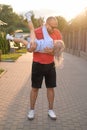 Dad holds little daughter in arms, looking at her and laughing merrily Royalty Free Stock Photo