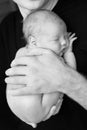 Dad holds his sleeping newborn baby Royalty Free Stock Photo