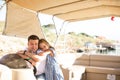 Dad with kid girl helm boat on pier. tour on water