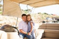 Dad with kid girl helm boat on pier. tour on water