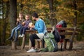 A dad and kids enjoying the fruits in the break of hiking Royalty Free Stock Photo