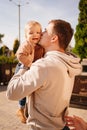 dad kisses and plays with his son. games and walks with children. Royalty Free Stock Photo