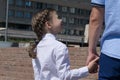 Dad leads her daughter for the first time to school Royalty Free Stock Photo