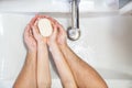 Dad with little daughter thorough washing hands