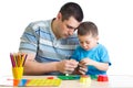 Dad and son handworking at table Royalty Free Stock Photo