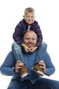 Dad and little son are smiling and hugging. Love and tenderness in a relationship. Isolated on white background. Vertical Royalty Free Stock Photo