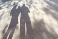 Dad mom and baby. Family shadows on asphalt. Silhouettes of parents and little child