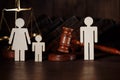 Dad and mom with child figures with judge gavel. Divorce concept Royalty Free Stock Photo