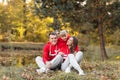 Dad, mom and little cute daughter having fun and playing in the autumn park. family concept, father`s, mother`s and baby`s day Royalty Free Stock Photo