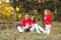 Dad, mom and little cute daughter having fun and playing in the autumn park. family concept, father`s, mother`s and baby`s day Royalty Free Stock Photo