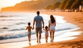 Dad and Mom run along the beach with their children Royalty Free Stock Photo