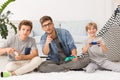 Dad playing video games with his sons Royalty Free Stock Photo