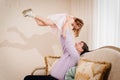 dad plays with his daughter and tosses her up. paternal love.