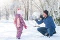 Dad plays with his daughter in the winter outside Royalty Free Stock Photo