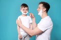 Dad pretending to shave his little son