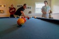 Dad shooting pool with his sons Royalty Free Stock Photo