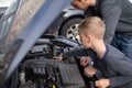 Dad shows his little happy son how the car works Royalty Free Stock Photo