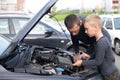 Dad shows his little happy son how the car works Royalty Free Stock Photo