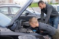 Dad shows his little happy son how the car works Royalty Free Stock Photo