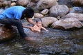 Dad and smiling boy swimming in the river