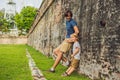 Dad and son on background of Fort Cornwallis in Georgetown, Pena Royalty Free Stock Photo