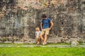 Dad and son on background of Fort Cornwallis in Georgetown, Penang, is a star fort built by the British East India Company in the Royalty Free Stock Photo