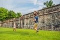 Dad and son on background of Fort Cornwallis in Georgetown, Penang, is a star fort built by the British East India Company in the Royalty Free Stock Photo