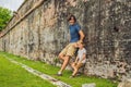 Dad and son on background of Fort Cornwallis in Georgetown, Pena Royalty Free Stock Photo