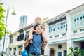 Dad and son in the background of Old houses in the Old Town of Georgetown, Penang, Malaysia Royalty Free Stock Photo