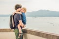 Dad and son in the background of Tropical beach landscape panorama. Beautiful turquoise ocean waives with boats and sandy Royalty Free Stock Photo