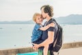 Dad and son in the background of Tropical beach landscape panorama. Beautiful turquoise ocean waives with boats and Royalty Free Stock Photo