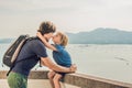 Dad and son in the background of Tropical beach landscape panorama. Beautiful turquoise ocean waives with boats and Royalty Free Stock Photo