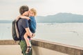 Dad and son in the background of Tropical beach landscape panorama. Beautiful turquoise ocean waives with boats and Royalty Free Stock Photo