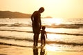 Dad and son on the beach Royalty Free Stock Photo