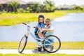 dad and son on biking adventure. dad and son duo pedaling through picturesque landscape. supportive dad guiding his son Royalty Free Stock Photo