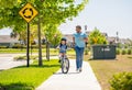 dad and son on biking adventure. dad and son duo pedaling through picturesque landscape. Nurturing family unity Royalty Free Stock Photo