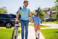 dad and son on biking adventure. dad and son duo pedaling through picturesque landscape. supportive dad guiding his son Royalty Free Stock Photo