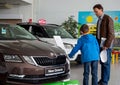 Dad and son choose a new car Royalty Free Stock Photo