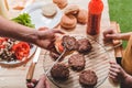 Dad and son cooking meat burgers together Royalty Free Stock Photo